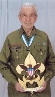 Joseph Lucania shows off the Boy Scout Badge project he designed