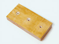 Countersinking is an effective means of attaching parts without glue. From left to right you'll see a countersink with a screw, an open countersink and a slightly countersunk hole used in this project.