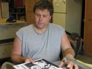 Erik Warren works on a scroll saw project. Despite having autistim, Erik has his own scrolling business.