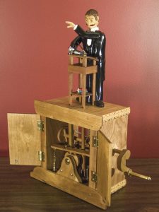 Machini the Magician performs a levitation act.